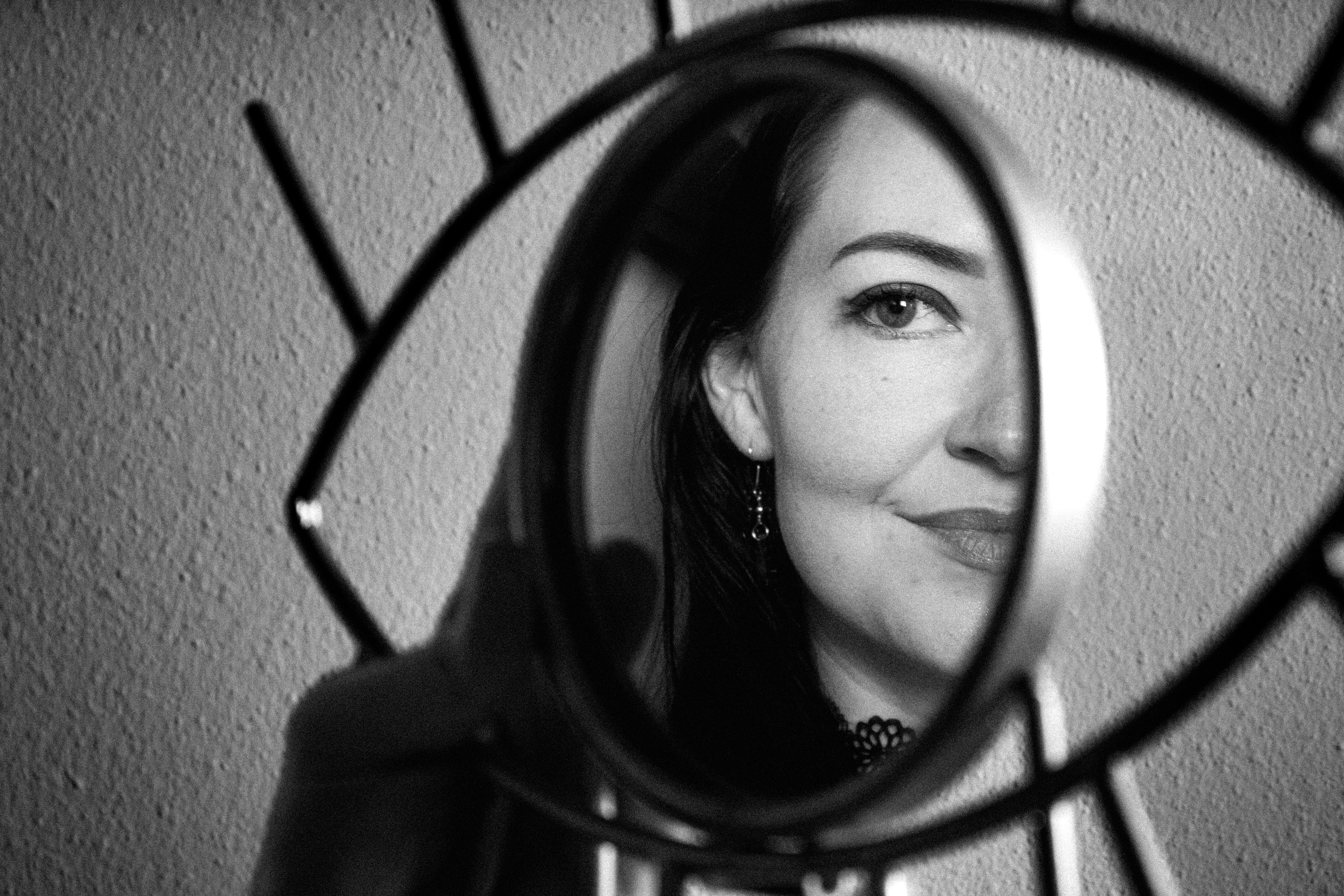 Photo of Rachel (my girlfriend) looking in an eye-shaped mirror